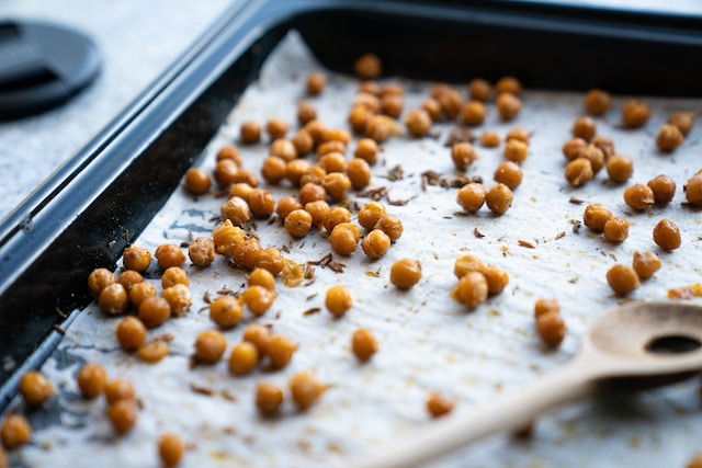 Cooked chickpeas on a baking tray