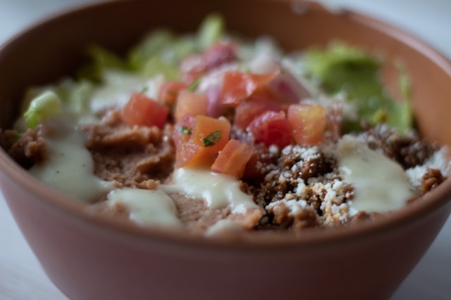 A bowl filled with beef burrito fillings