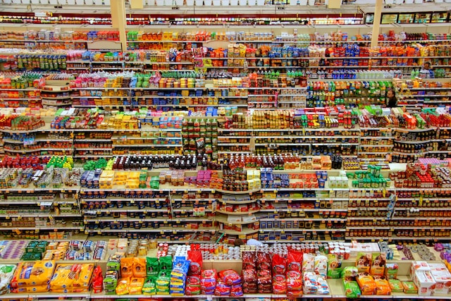 A shot of a section of a store, displaying the wide assortment of goods being sold. 