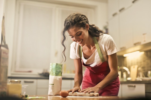 Smiling woman baking in the kitchen