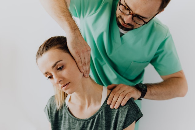 Woman getting a chiropractic adjustment