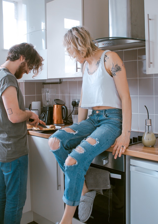 A couple cooking in the kitchen