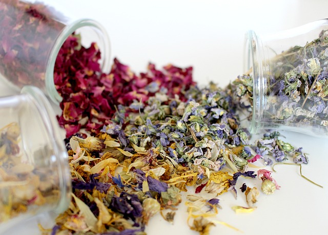 Dried flowers spilling oput of clear glass containers